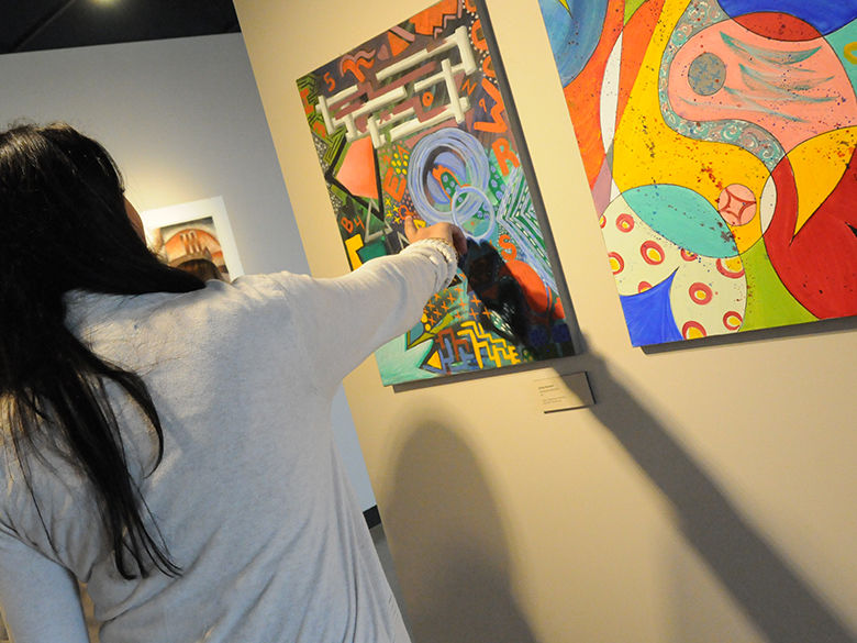 community members pointing at artwork that is part of the penn state lehigh valley collection