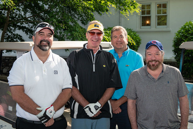 four men ready to golf