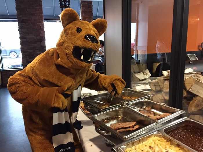 Nittany Lion next to BBQ food