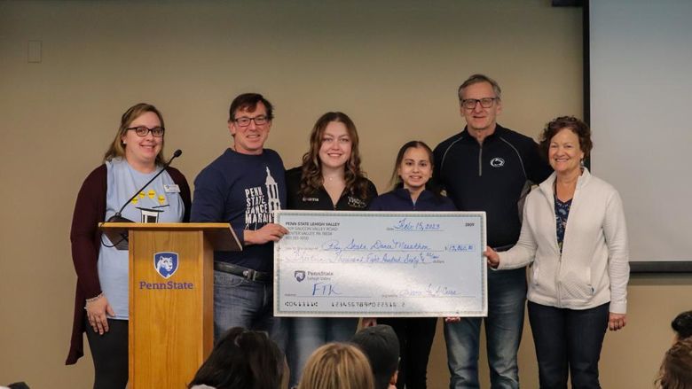 Dance for a Cure presenting check to PSU-LV Benefitting THON's Executive board 