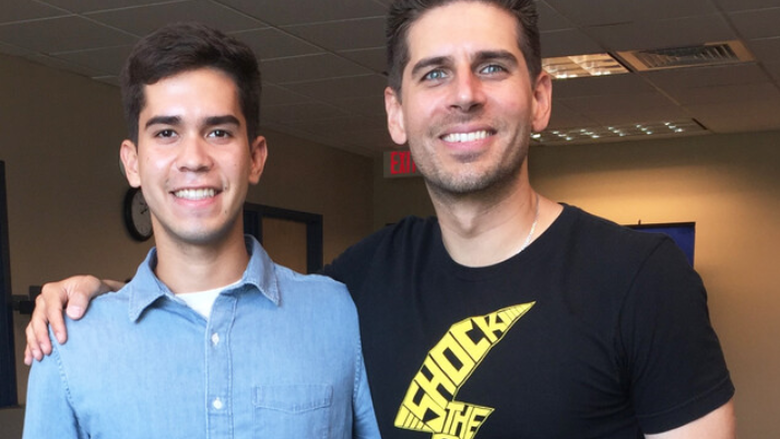 Carlos Andres Gomez, right, with student Juan Martinez in 2018