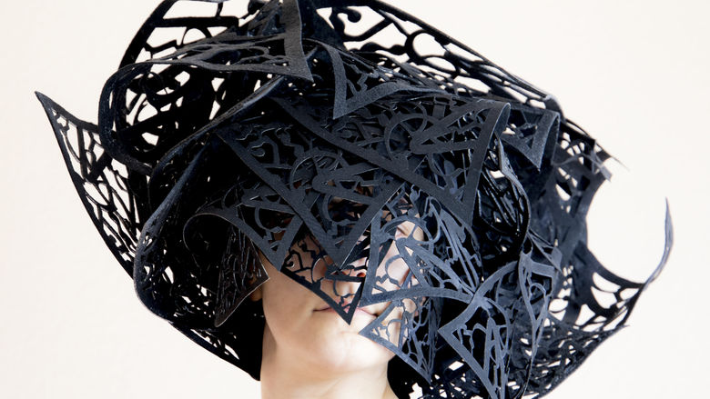 artwork in shape of a hat made of laser cut fiber 