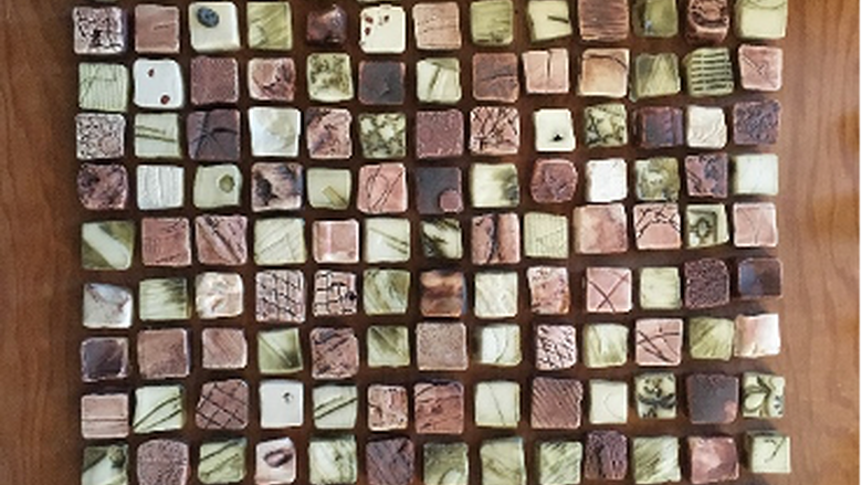 Small square tiles arranges in a larger square