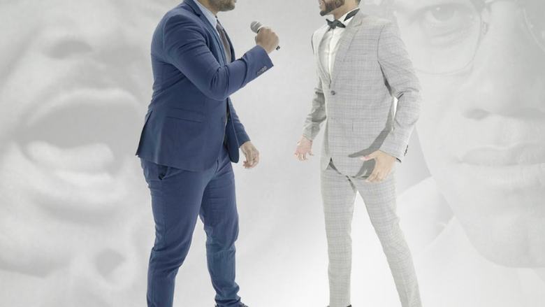 Image of two men engaging in a rap battle