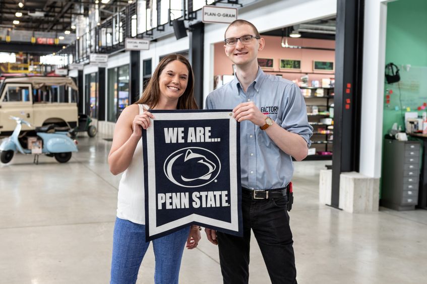 two people holding Penn State banner