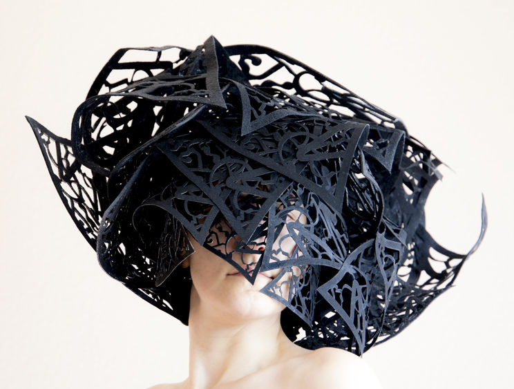artwork in shape of a hat made of laser cut fiber 