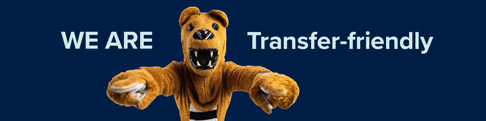 Navy background with Nittany Lion in the middle pointing at viewer with both hands.