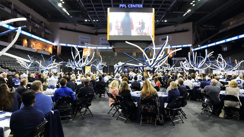 300 people seated at tables in PPL Center