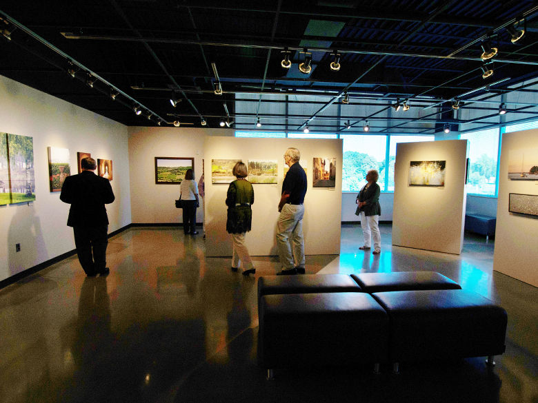 people enjoying artwork in the ronald k. de long gallery