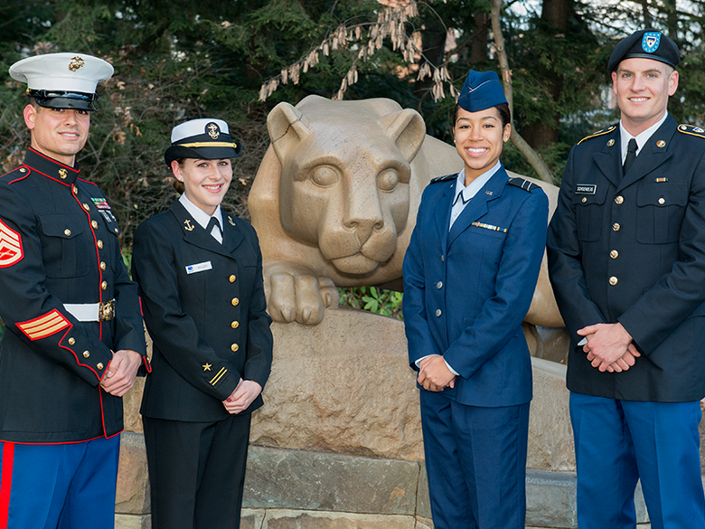 ROTC members standing by Lion Shrine