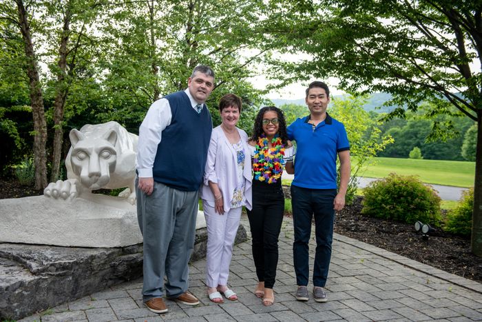 four people in front Nittany Lion