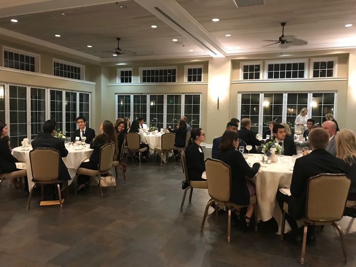 Group of students and alumni having dinner at a country club
