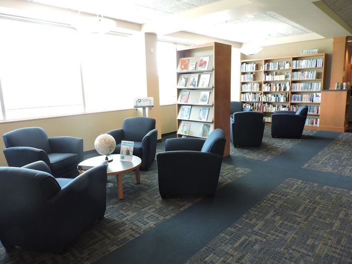 chairs and bookshelves in library