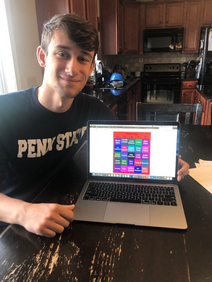young man with his laptop playing bingo online