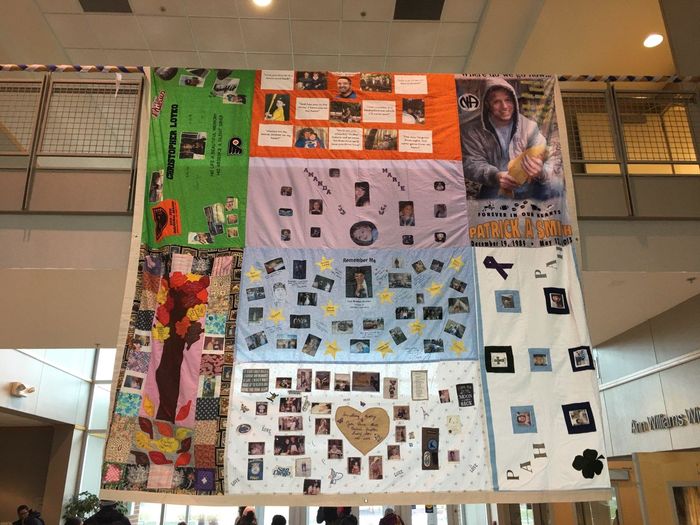 quilt hanging from upper level