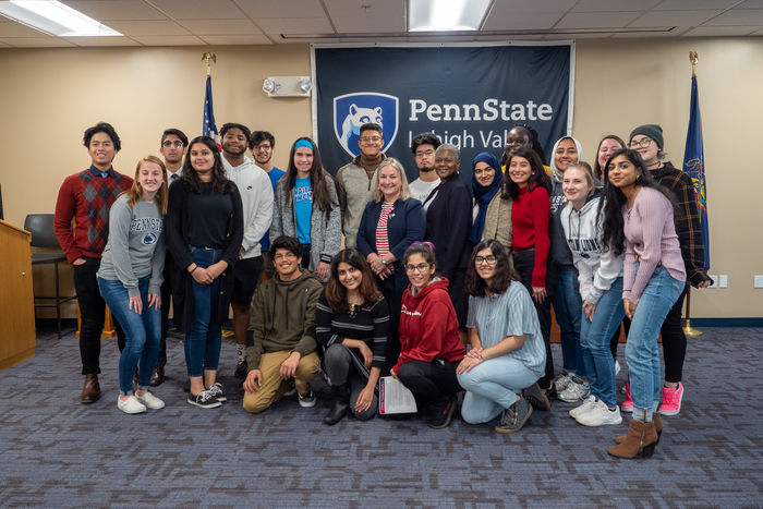 Congresswoman and chancellor posed with students