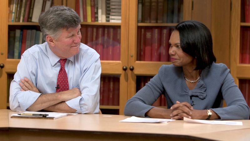 David M. Kennedy and Condeleeza Rice sitting in a library