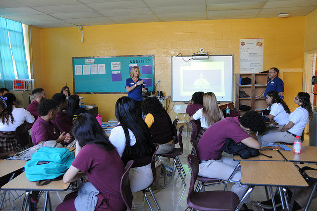 Liz Keptner shows the students how to use a GoPro