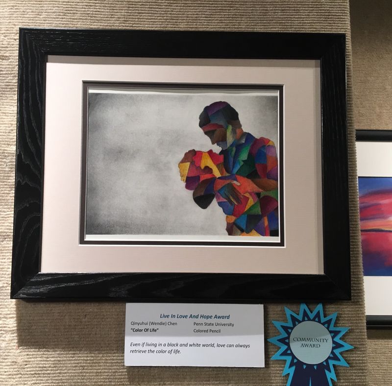 colored pencil drawing in a frame on display