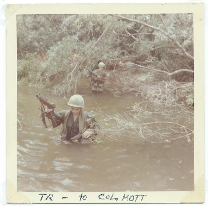 Tom Roney crossing a river in Vietnam