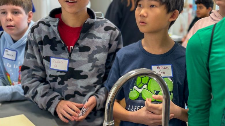 Children looking at the camera smiling 