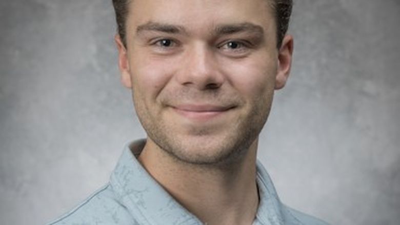 male smiling at camera 