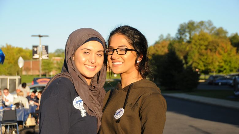 two students smiling