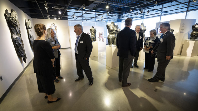 Campaign Celebration attendees walking around campus Art Gallery