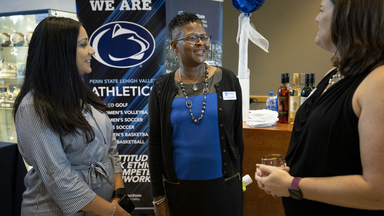 Chancellor Richardson speaking with Christina Luey and Hiba Moussa 