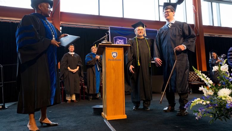 Graduate walking with cane to get his degree from Chancellor