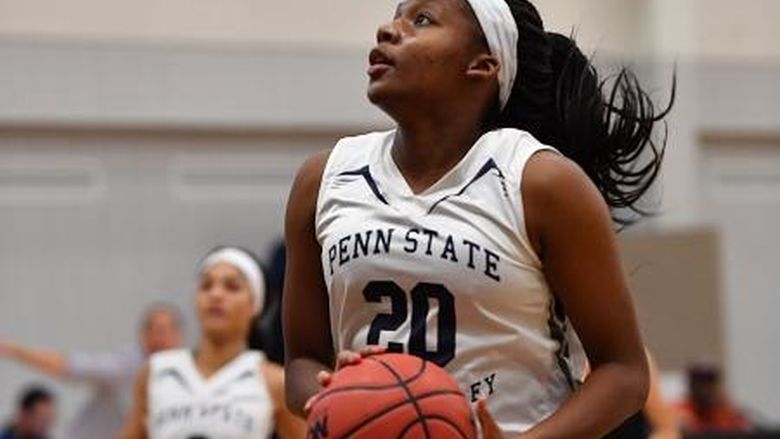 woman about to shoot a basketball