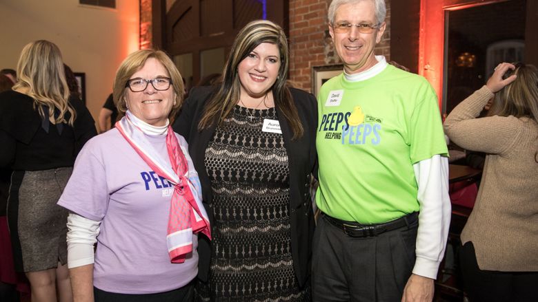 three people posing in a photo