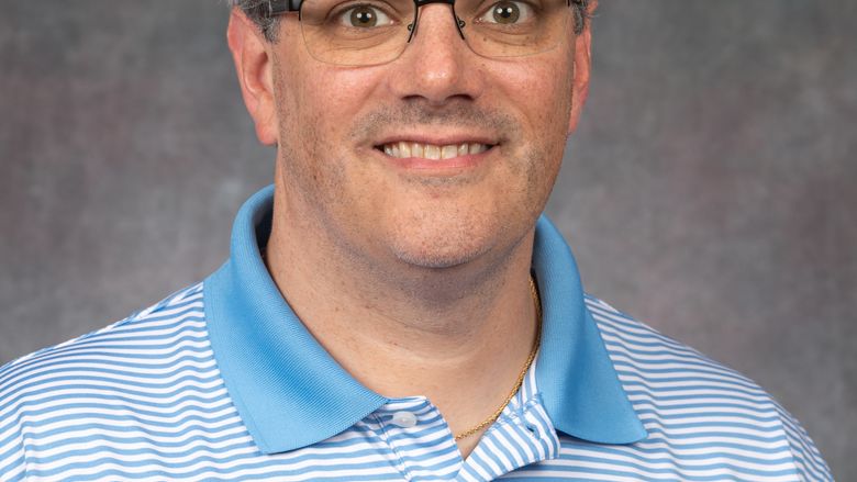 headshot of Eric Robbins