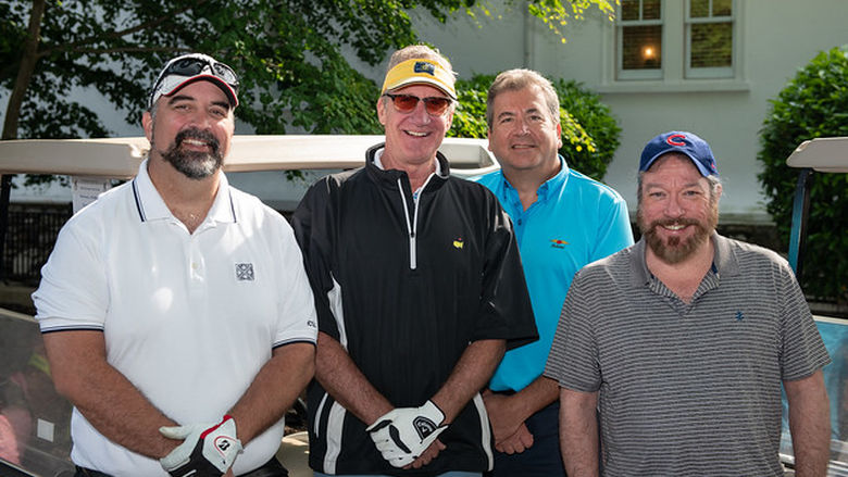 four men ready to golf