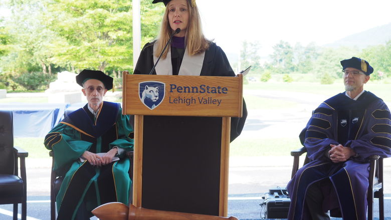 woman speaking at podium