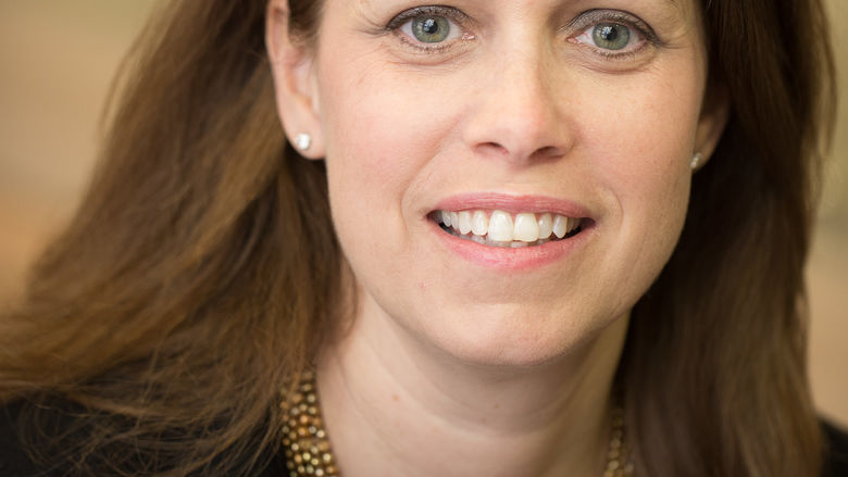 head shot of woman with medium length brown hair