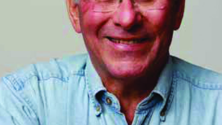 head shot of man with glasses
