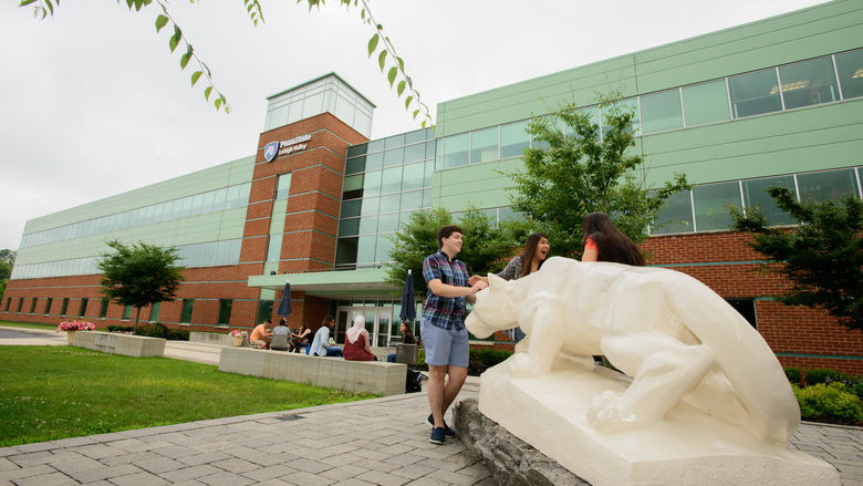 students by Lehigh Valley's Nittany Lion Shrine outside of building