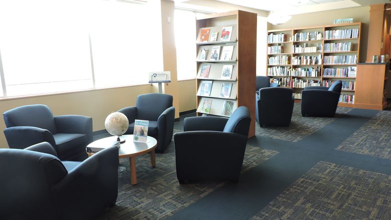 chairs and bookshelves in library