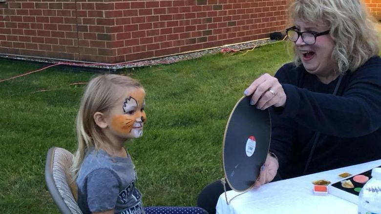 girl with lion face painting