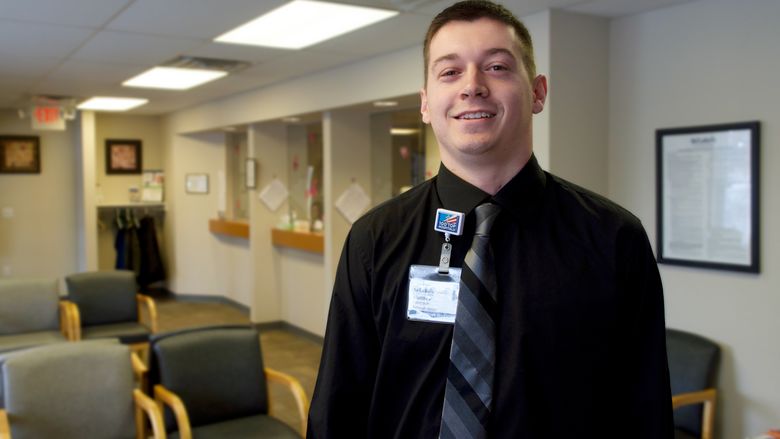 young man at medical office lobby