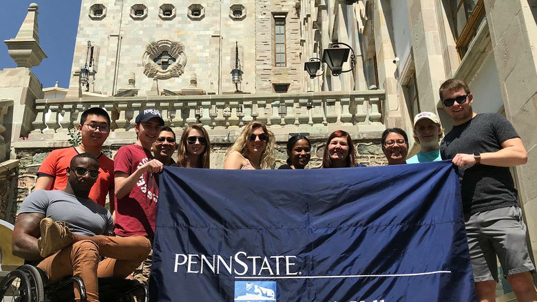 Group of students with PSU-LV banner in Mexico