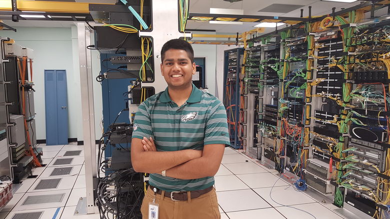 Student posing at his internship at PPL. 