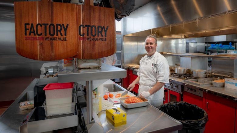 cook smiling in kitchen