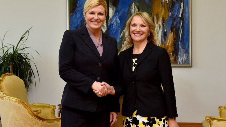 Nikki Gutgold shaking hands with President of Croatia