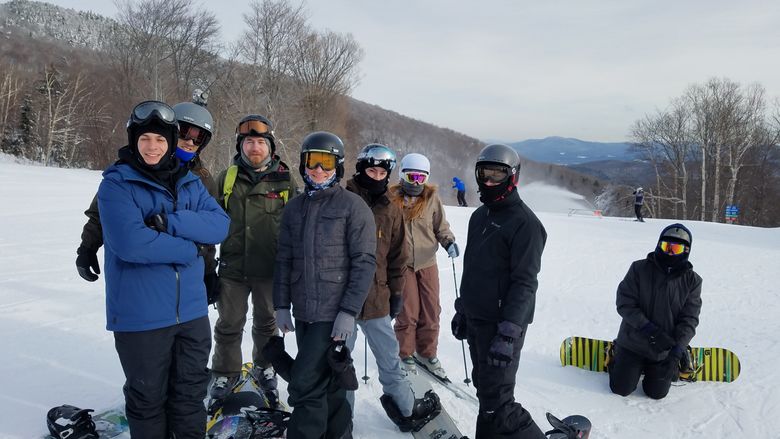 several skiers on top of a mountain