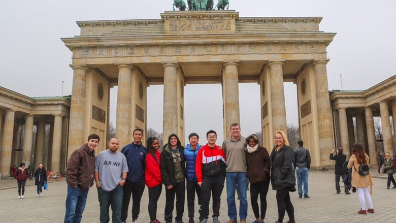 group of students and faculty in front of monument in Berlin