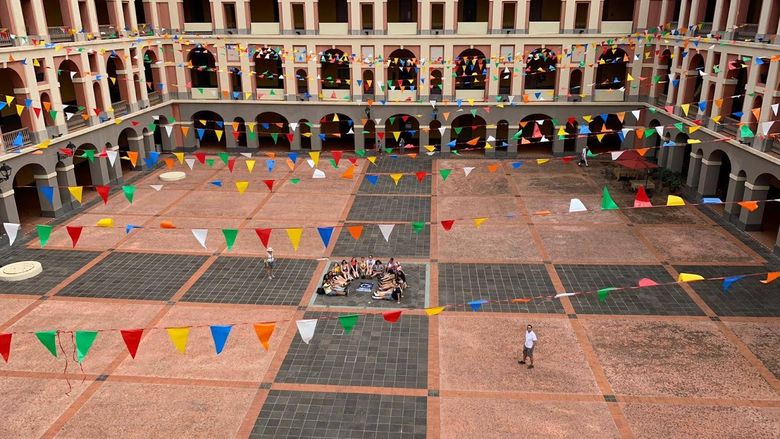students laying down in square in Puerto Rico infantry barracks
