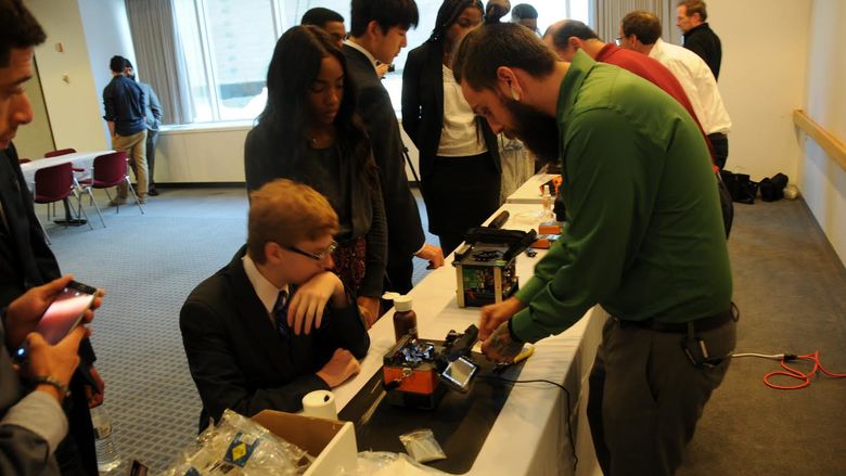students at desk working on project