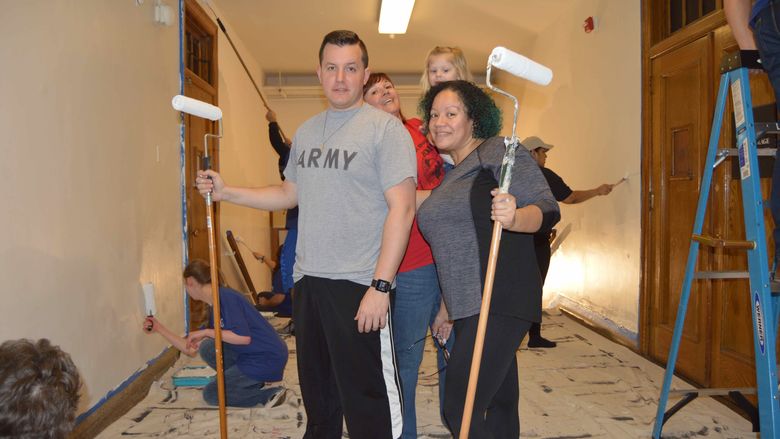 Group of volunteers painting 
